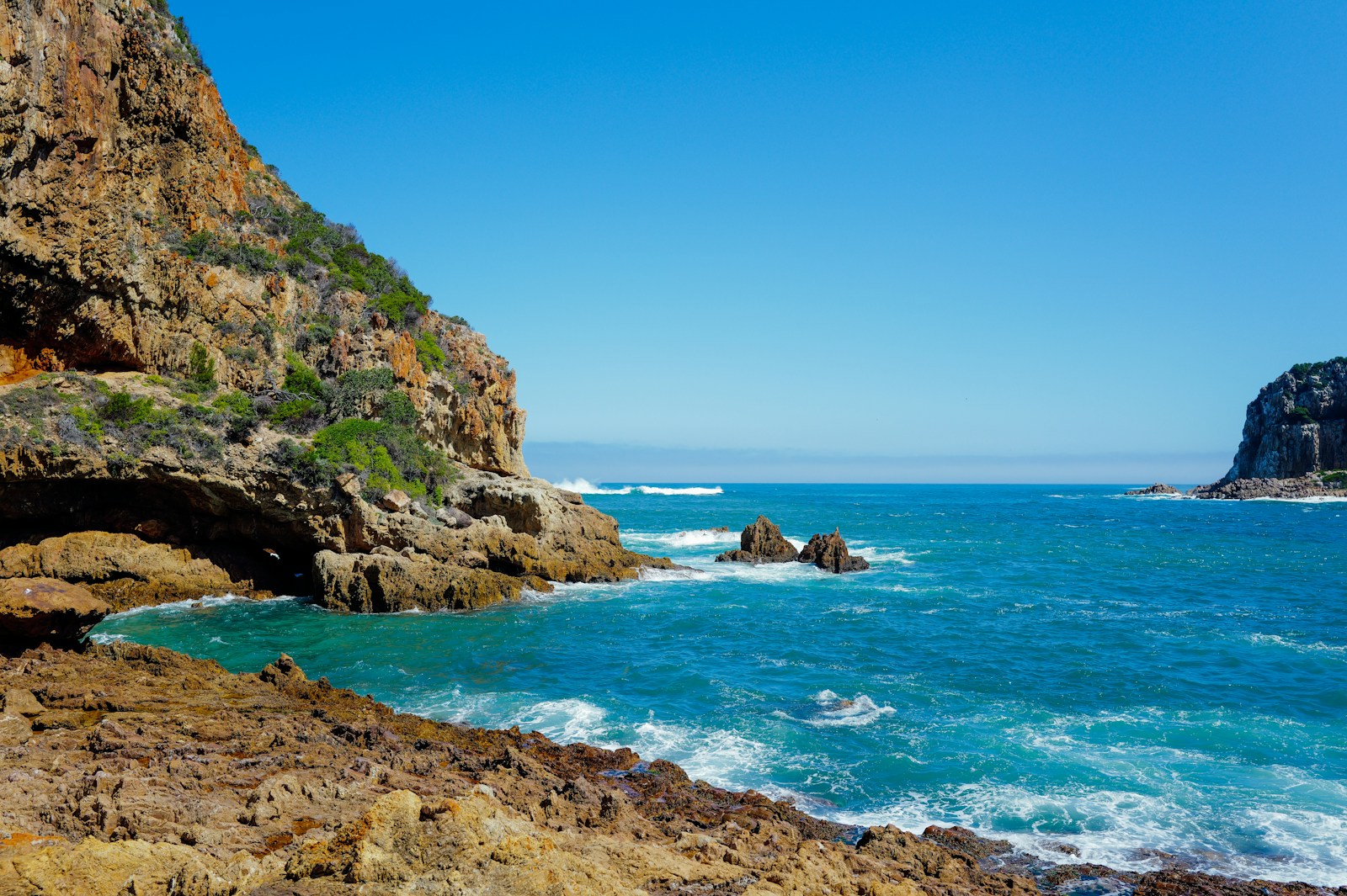 Rocky headlands and blue ocean at Knysna Heads on the Garden Route